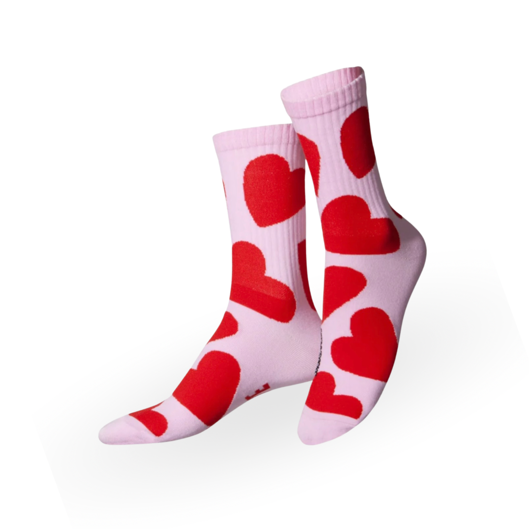 Rosafarbene Eat My Socks Socken mit roten Herzen