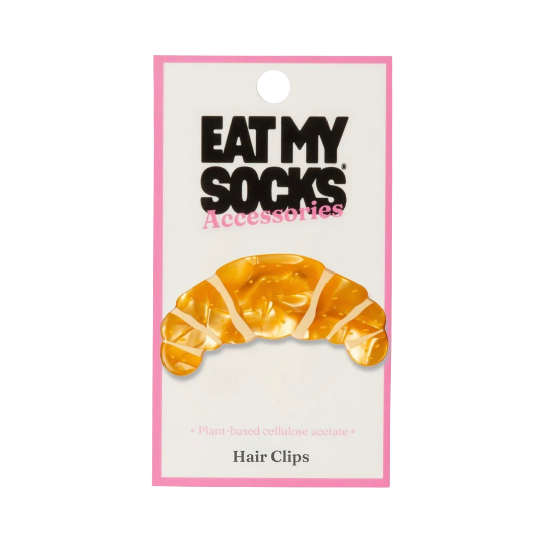 Gelbe Croissant-Haarspange von Eat My Socks in Verpackung